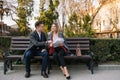 Happy Business Man and Woman Chatting on Bench. Royalty Free Stock Photo