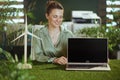 happy business owner woman showing laptop blank screen Royalty Free Stock Photo
