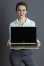 happy business owner woman showing laptop blank screen Royalty Free Stock Photo