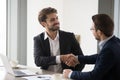 Happy business partners handshaking after successful meeting Royalty Free Stock Photo