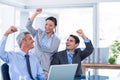 Happy business people cheering together Royalty Free Stock Photo