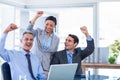 Happy business people cheering together Royalty Free Stock Photo