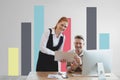 Happy business people at a desk using a tablet against white wall with graphics Royalty Free Stock Photo