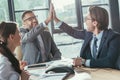 happy business people giving high five during meeting Royalty Free Stock Photo