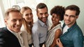 Happy business people. Group of cheerful colleagues taking selfie and smiling while standing in the modern office Royalty Free Stock Photo