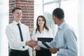 Business people shaking hands with each other in the office. Royalty Free Stock Photo