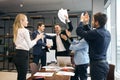 Cheerful positive business people standing around the table applauding Royalty Free Stock Photo