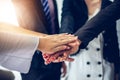 Happy Business people showing team work and giving five after signing agreement or contract with foreign partners in office Royalty Free Stock Photo