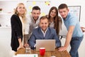 Happy business people team together near laptop in office Royalty Free Stock Photo