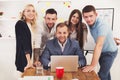 Happy business people team together near laptop in office Royalty Free Stock Photo