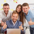 Happy business people team together near laptop in office Royalty Free Stock Photo