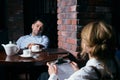 Happy business people working together on laptop in a restaurant Royalty Free Stock Photo