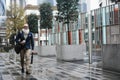 Happy business senior man walking to work on rainy winter day - Focus face Royalty Free Stock Photo