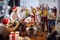 Happy business team have fun and dancing in Santa hat at Xmas party Royalty Free Stock Photo