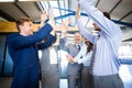 Happy business team high fiving Royalty Free Stock Photo