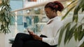 Happy business woman african american girl worker manager young female sitting in corridor office modern creative Royalty Free Stock Photo