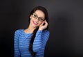 Happy business woman in blue clothing and eye glasses looking on Royalty Free Stock Photo