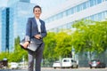 Happy business woman with briefcase in modern office district Royalty Free Stock Photo