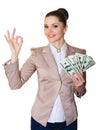 Happy business woman with a bundle of dollars