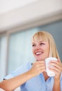 Happy business woman with coffee cup. Portrait of pretty young business woman having coffee during break. Royalty Free Stock Photo