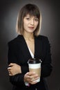 Happy business woman with cup