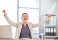 Happy business woman with document rejoicing Royalty Free Stock Photo