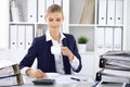 Happy business woman or female accountant having some minutes for time off and pleasure at working place. Audit and tax Royalty Free Stock Photo