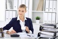 Happy business woman or female accountant having some minutes for time off and pleasure at working place. Audit and tax Royalty Free Stock Photo