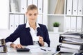 Happy business woman or female accountant having some minutes for time off and pleasure at working place. Audit and tax Royalty Free Stock Photo