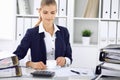 Happy business woman or female accountant having some minutes for time off and pleasure at working place. Audit and tax Royalty Free Stock Photo