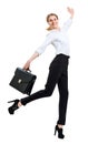 Happy business woman in formal wear jumping with briefcase. Royalty Free Stock Photo