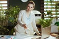 happy business woman in green office giving hand for handshake Royalty Free Stock Photo