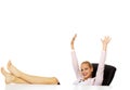 Happy business woman with hands up holding legs on the desk Royalty Free Stock Photo