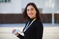 Young business woman holding identification card on urban background. Business co-working teamwork concept Royalty Free Stock Photo