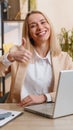 Happy business woman looking approvingly at camera showing thumbs up, like positive sign, good news Royalty Free Stock Photo
