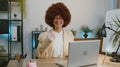 Happy business woman looking approvingly at camera showing thumbs up, like positive sign, good news