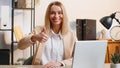 Happy business woman looking approvingly at camera showing thumbs up, like positive sign, good news Royalty Free Stock Photo