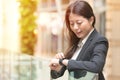 Happy business woman looking at her smartwatch Royalty Free Stock Photo