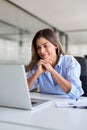 Happy business woman of middle age looking at laptop working in office. Vertical Royalty Free Stock Photo