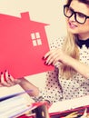 Happy business woman in office holding house Royalty Free Stock Photo