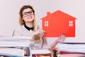 Happy business woman in office holding house Royalty Free Stock Photo