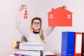 Happy business woman in office holding house Royalty Free Stock Photo