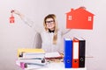 Happy business woman in office holding house Royalty Free Stock Photo