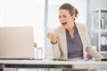 Happy business woman in office rejoicing success Royalty Free Stock Photo