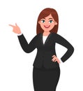 Happy business woman pointing hand to copy space away. Business woman presenting or introducing something.