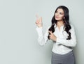 Happy business woman pointing her finger to empty copy space Royalty Free Stock Photo