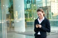 Happy business woman reading text message on mobile phone Royalty Free Stock Photo