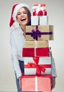 Happy Business Woman Santa Girl Holding Heap Of Christmas Gift.