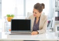 Happy business woman showing laptop blank screen Royalty Free Stock Photo