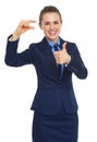 Happy business woman showing small risks gesture and thumbs up Royalty Free Stock Photo